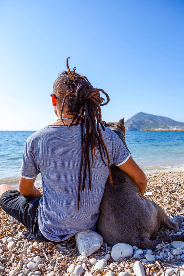Back view of man with dog